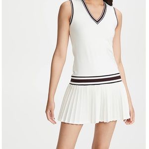 Tory Burch tennis dress features striped edges and a pleated skirt